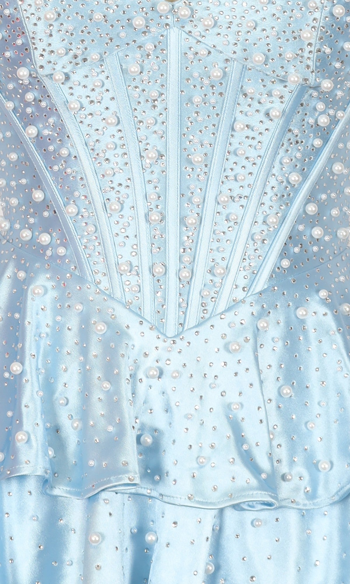 Close-up of the PromGirl Exclusive 250347 short homecoming dress in light blue satin, detailed with pearl embellishments, rhinestones, structured panels, and a ruffled waistband.